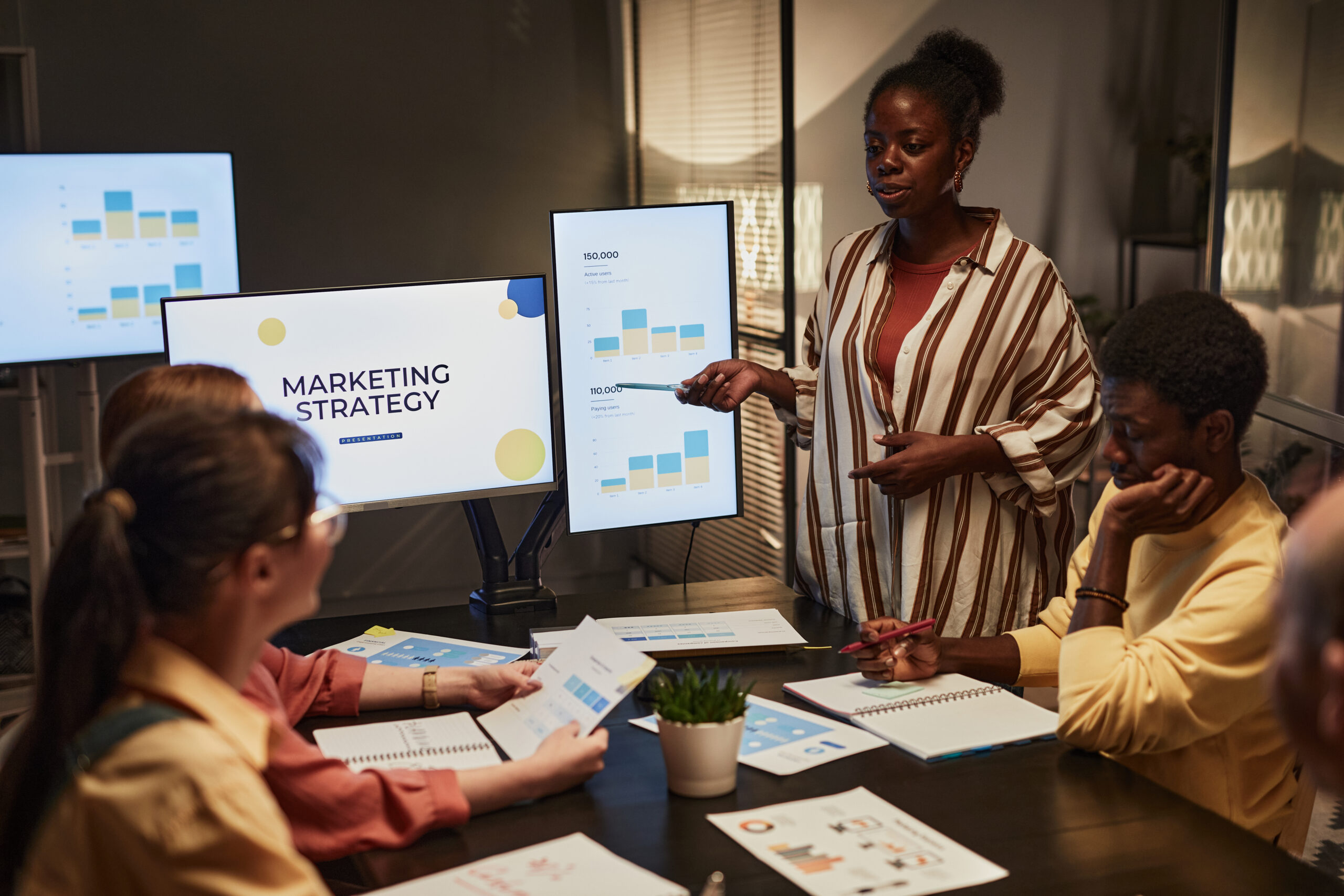 A professional team collaborating during a meeting, showcasing real-world marketing jobs in action.